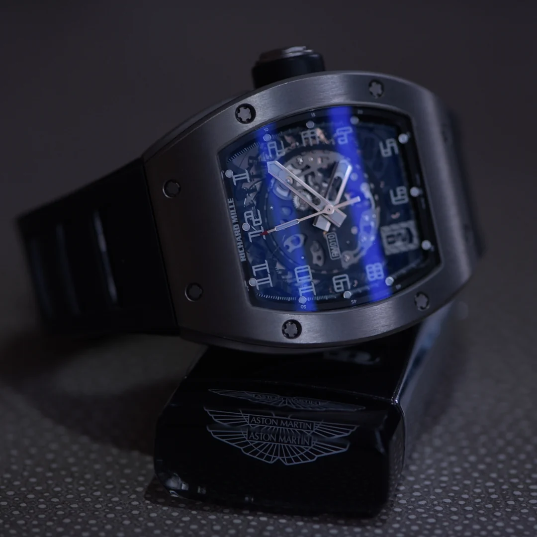 Richard Mille watch resting on an Aston Martin branded case