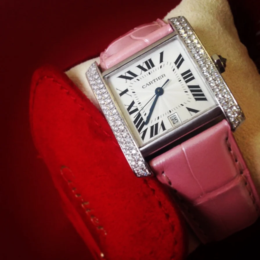 Cartier Tank watch with diamond bezel and pink strap