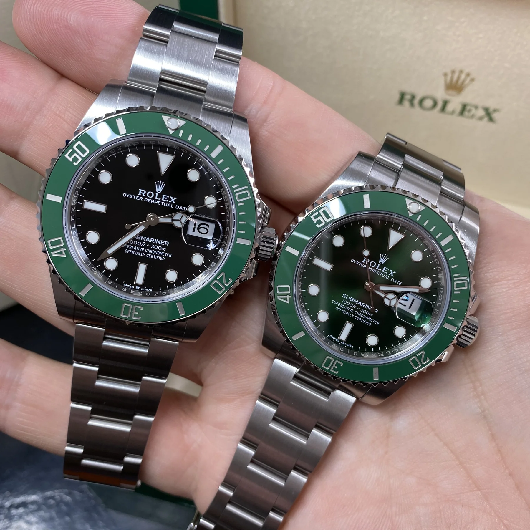 A pair of Rolex Submariner Date watches with green bezels